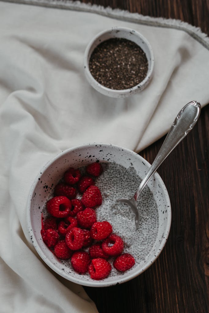 Red Berries in White Ceramic Bowl