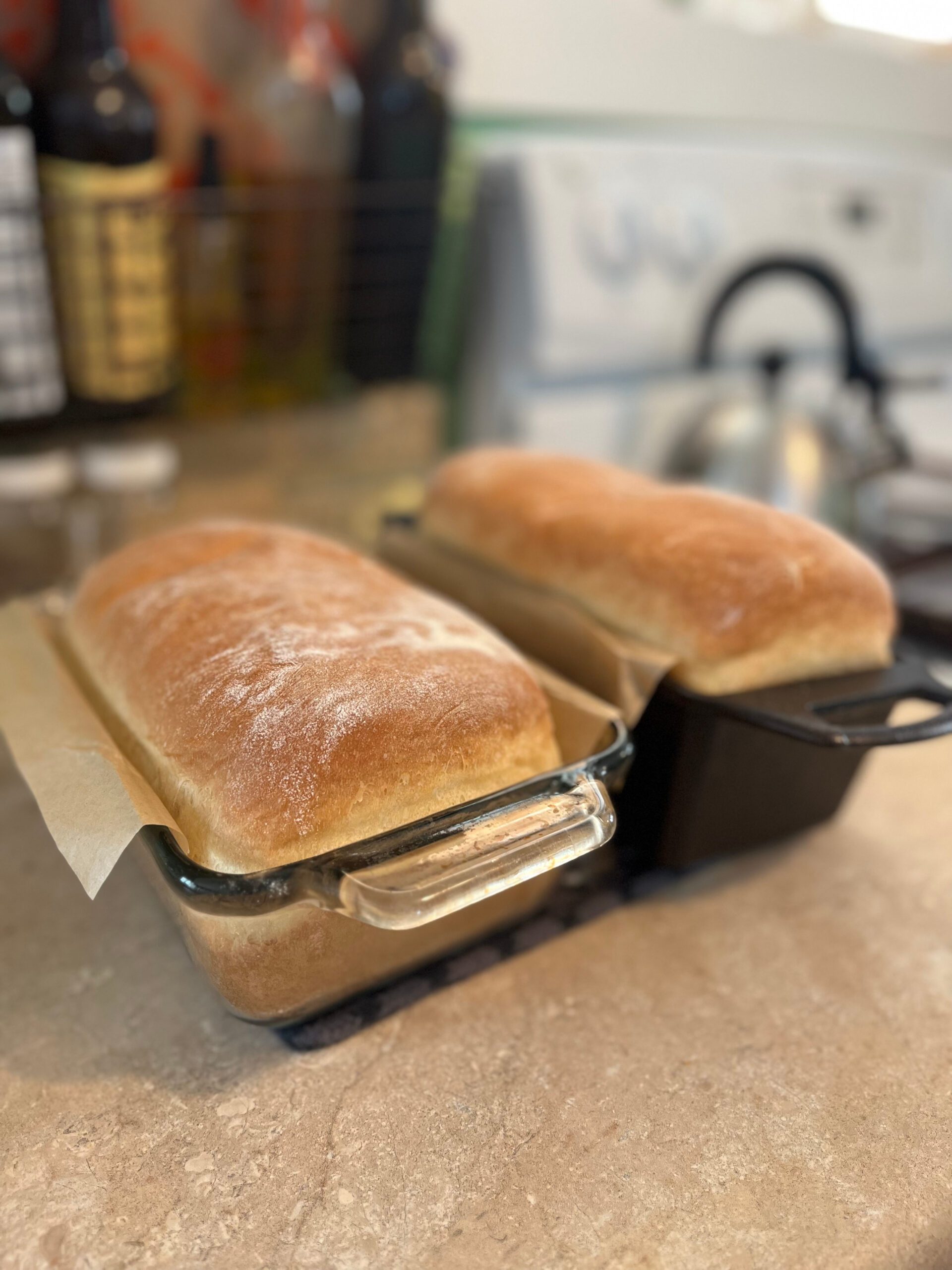 fresh baked bread sitting on a countertop