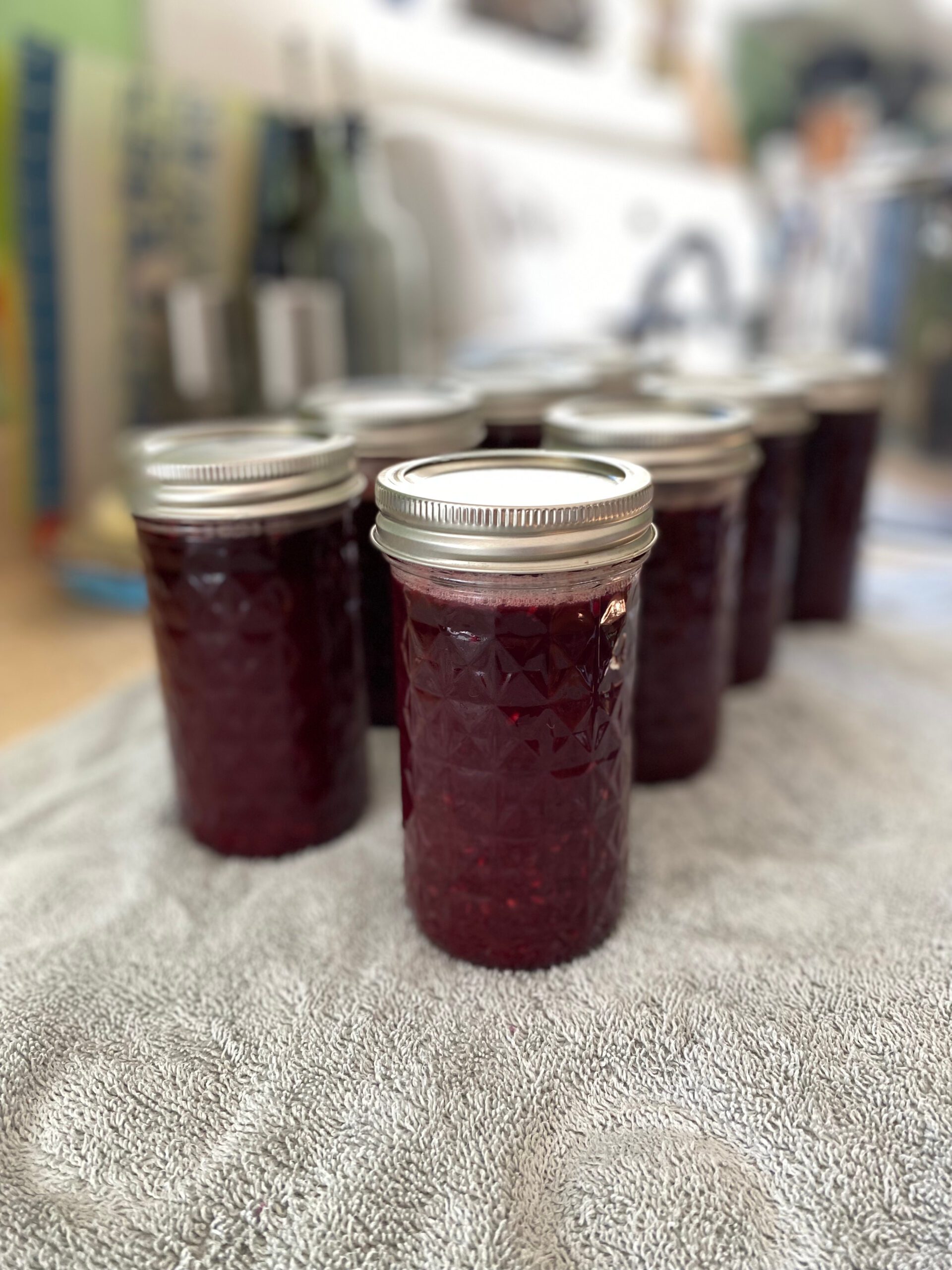 fresh canned jelly sitting on a towel