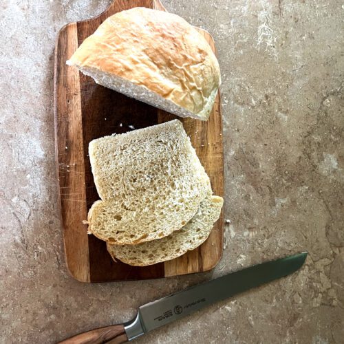 sliced sandwich bread laying on a cutting board