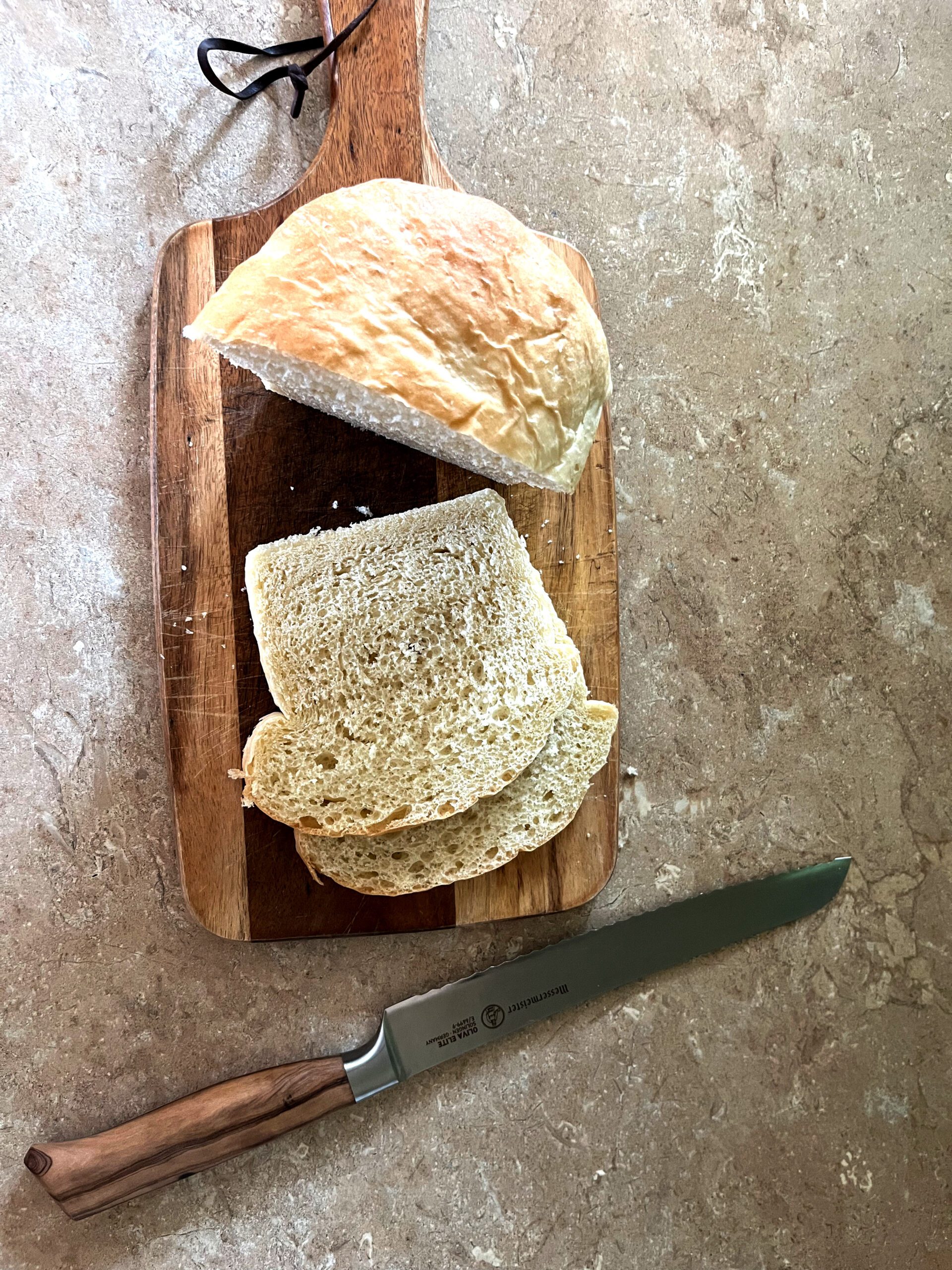 sliced sandwich bread laying on a cutting board