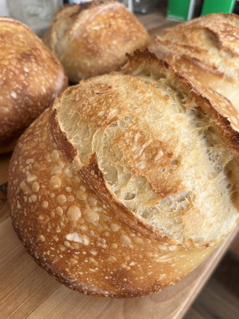 Fresh sourdough sitting on the counter to cool