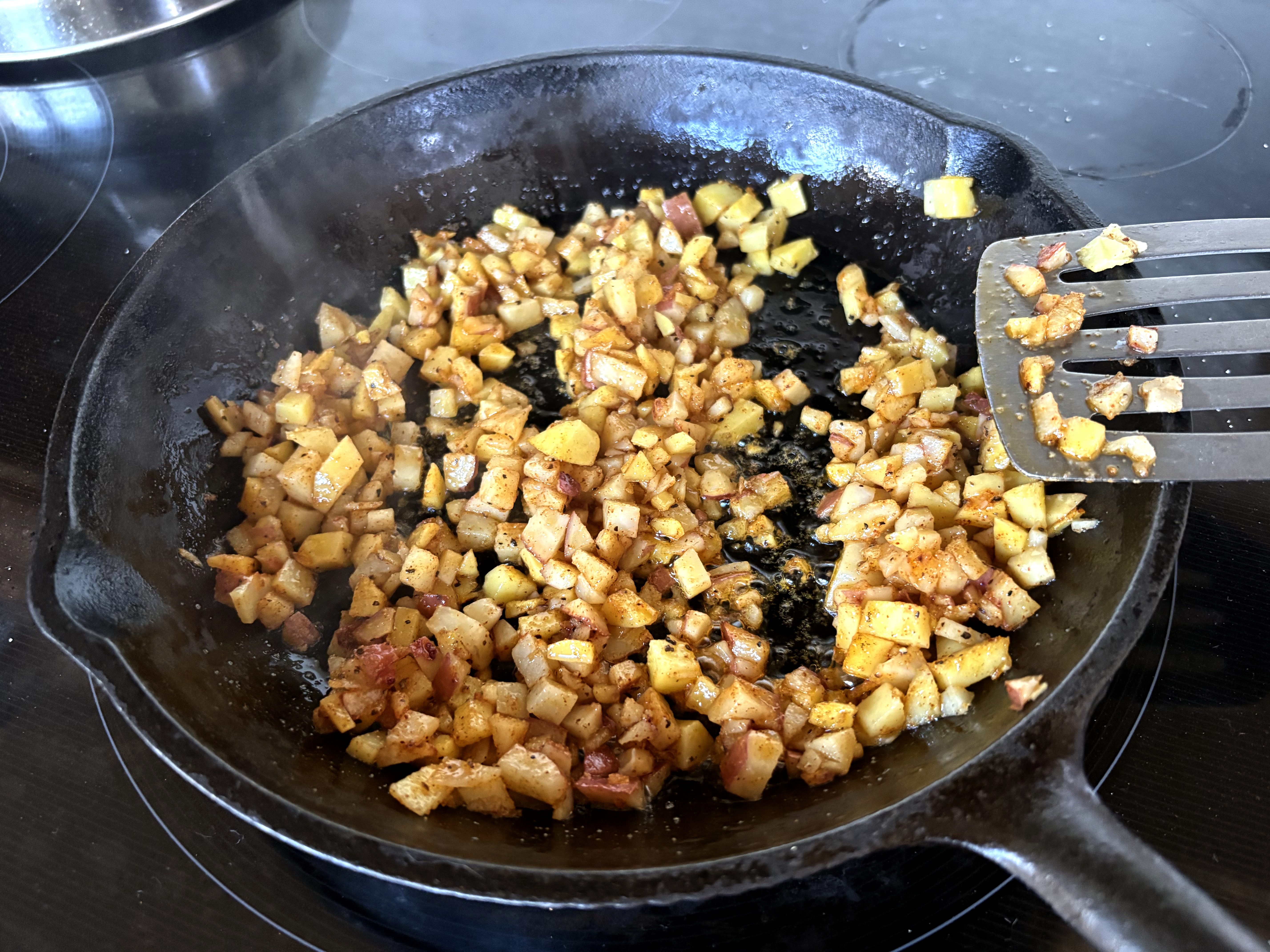 potatoes frying in a pan