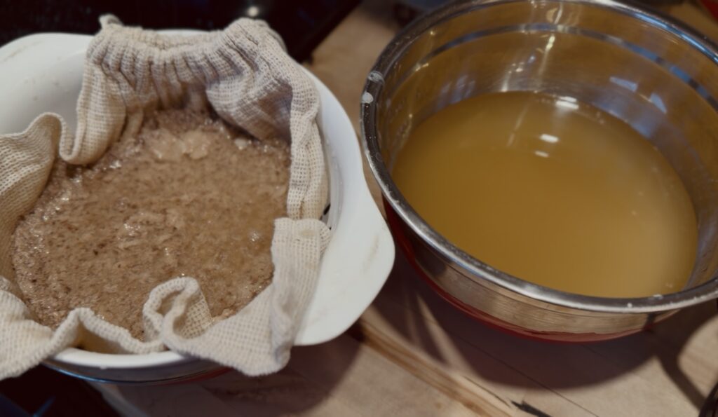 rendered deer fat being strained