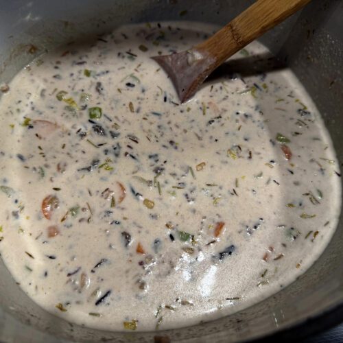 creamy wild rice and mushroom soup on the stove