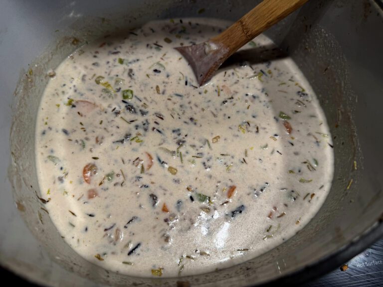 creamy wild rice and mushroom soup on the stove