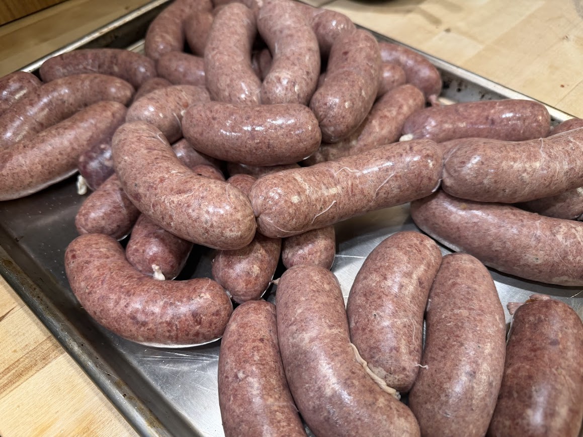 sausage links on a cookie sheet