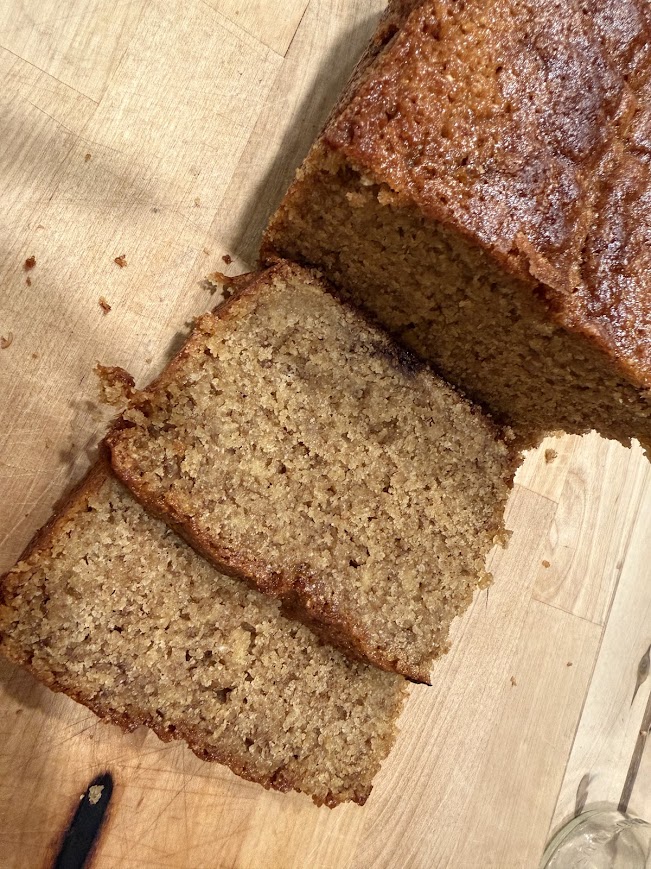 fresh sliced banana bread on a cutting board